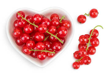 Red currant berries in a ceramic bowl isolated on white background. Top view. Flat lay