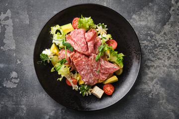  gourmet antipasto platter with assorted meats, cheeses, and fresh vegetables