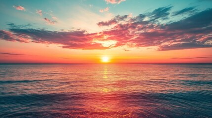 A serene sunset over the ocean, blending vibrant colors and calm waters.