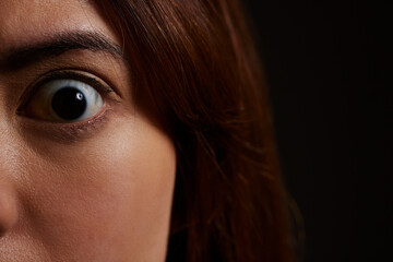 Woman, portrait and eye with shock in horror for fear, trauma or mental illness in asylum or studio...