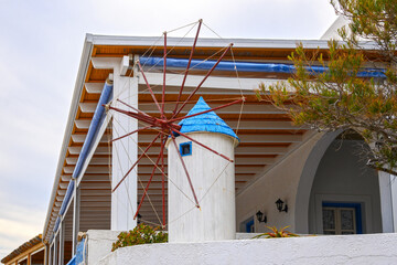A small windmill in Cycladic style on street in Tholaria village. Amorgos, Greece