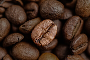 Naklejka premium Coffee bean on fire background. Aromatic coffee. Roasted coffee beans. Freshly roasted coffee with fire and smoke.