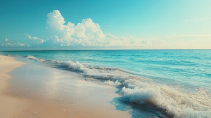 Sandy Beach with Blue Ocean and White Clouds