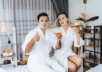 Serene modern daylight ambiance of spa salon, couple customer indulges in rejuvenating with facial...