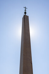 A Backlit Spire in the Vatican Plaza