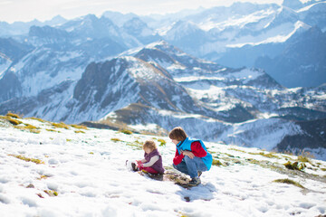 Family with kids hiking in the mountains