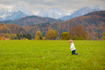 Naklejka premium Family with kids hiking in the mountains