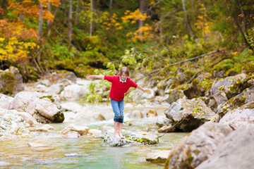 Family with kids hiking in the mountains