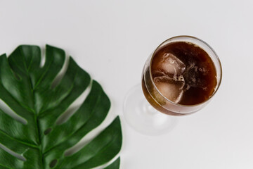 glass with cold iced coffee on a white background