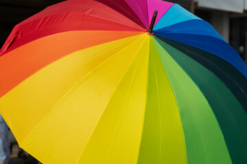 Rainbow umbrella in LGBT Pride festival parade