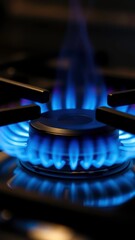 Dancing Blue Flames Illuminate a Modern Kitchen Stove During Evening Preparations for a Delightful Meal. Generative AI