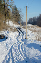 Road on snow in a frosty morning, natural background.