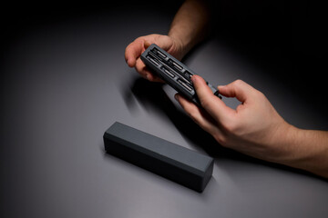 Person demonstrating precision with tools, repairing intricate electronics components