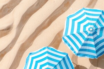 Closeup of striped beach umbrellas, vibrant colors against the sandy beach..