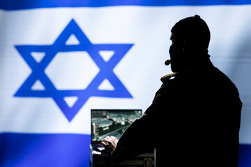 Israeli military dispatcher using headphones microphone, offering information to commanders...