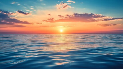 Obraz premium Beautiful sunset over calm blue ocean.