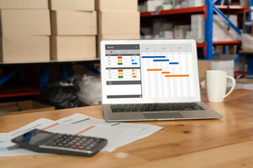 Project planning software for modish business project management on the computer screen showing timeline chart of the team project