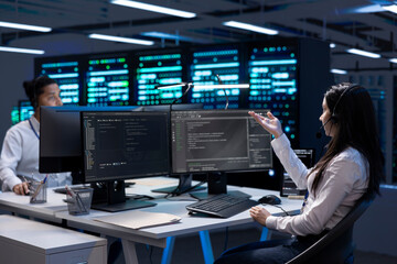 Data center workers in remote call, providing customer support, troubleshooting damages. Coworkers...