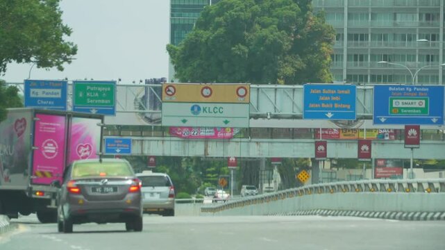 cutscene of urban city of Malaysia with multiple landmarks in established shot