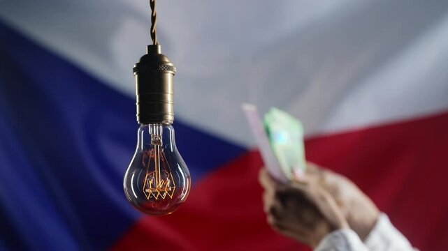 Glowing Edison light bulb on Czech Republic flag background. Woman counting money, crowns. Electricity price, bills, energy crisis, raising tariffs.