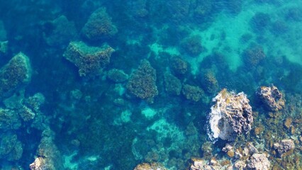 Rocky beach and sapphire sea water on the Maltese island, mediterranean sea, Ghajn Tuffieha bay , Malta. High quality photo