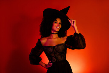 Photo of joyful gothic witch touch hat enjoy halloween theme masquerade for trick or treats fun...