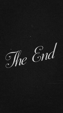 "The End" Vertical Old film movie text writing with grain background