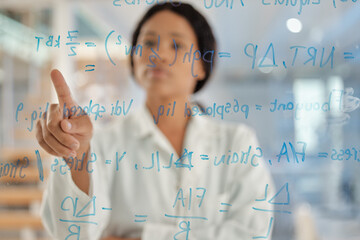 Woman, scientist and glass board with equation for brainstorming, problem solving or mathematics at...