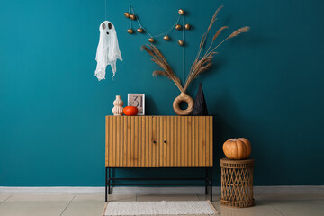 Interior of room decorated for Halloween with ghost and commode