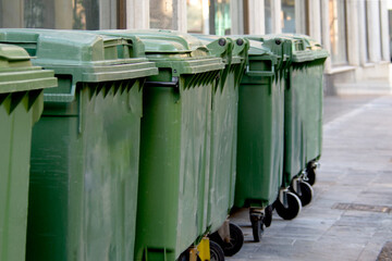 A group of garbage bins containers along a city street, disposal, waste recycling, waste...
