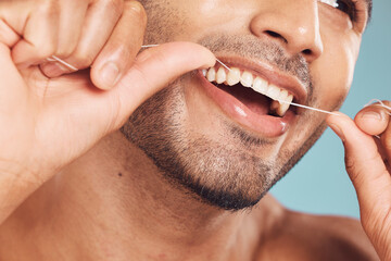 Studio, closeup and man with floss for dental, gum health and wellness with cleaning for fresh...