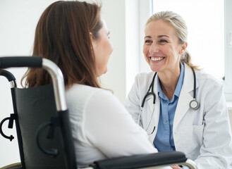Fototapeta premium Doctor comforting a patient in a wheelchair