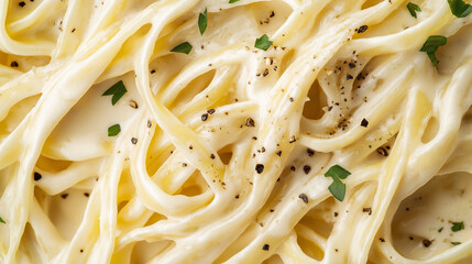 a close-up, top-down view of fettuccine alfredo, filling the entire frame with the focus on the pasta's intricate details