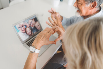 Grandparents sending love to their grandchildren over video call