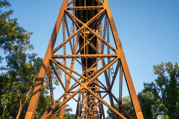 A Railroad bridge with a lot of metal and wood