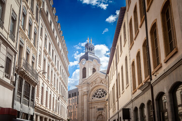 Entrance to Hotel Dieu with its clocktower seen from narrow streets of Vieux Lyon in the Presqu'Ile district. Hotel Dieu is a former hospital and a major landmark of Lyon