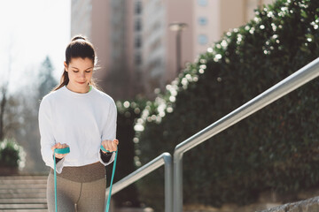 Being active is part of her every day routine - woman working out with elastic band