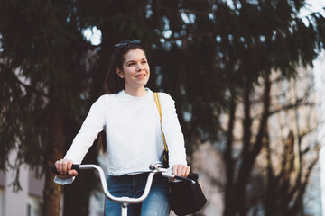 Caucasian woman living a sustainable lifestyle going to work by bike