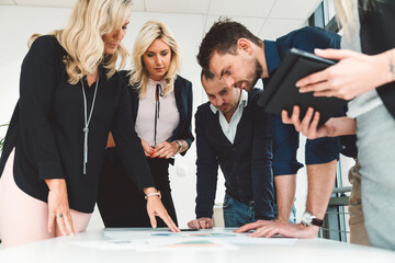 Group of business people gathered around the table