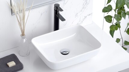 Fototapeta premium Modern Bathroom Sink with Black Faucet and White Countertop