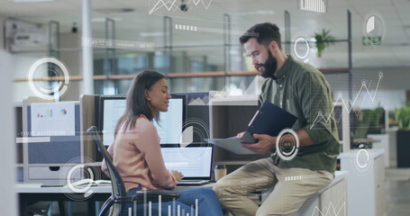 Image of data processing over diverse male and female colleague discussing at casual office