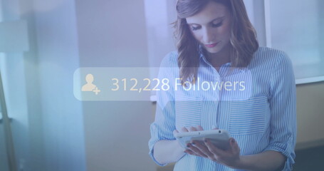205,584 followers image over woman using tablet in office