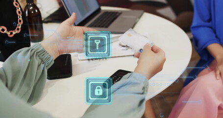 Image of padlock icons over caucasian woman paying online with card