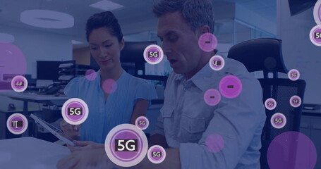 Image of 5g text and data processing over diverse business people using tablet