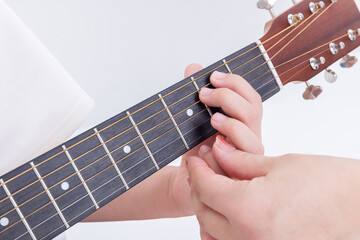 ギターを教える手元　girl with a guitar