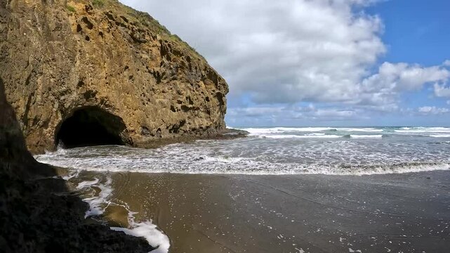 Bethells Cave, a dramatic sea cave located on Bethells Beach, also known as Te Henga Beach, on the Waitakere Coast of New Zealand