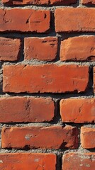Obraz premium Close-up of a Red Brick Wall with Mortar
