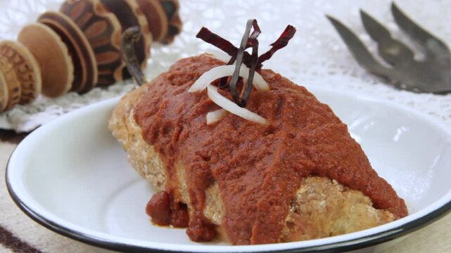 Stuffed and breaded poblano pepper with Adobo chipotle hot sauce.