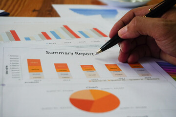 Excel graph with Spreadsheet Document showing Information Financial Startup Concept. Financial Planning making Accounting Database Report. Graphs and chart on screen with stationery set business stuff