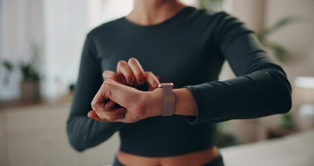Hands, woman and home with digital watch on checking or tracking health progress. Female person, closeup and fitness app on yoga for exercise, workout and healthy in living room for self care